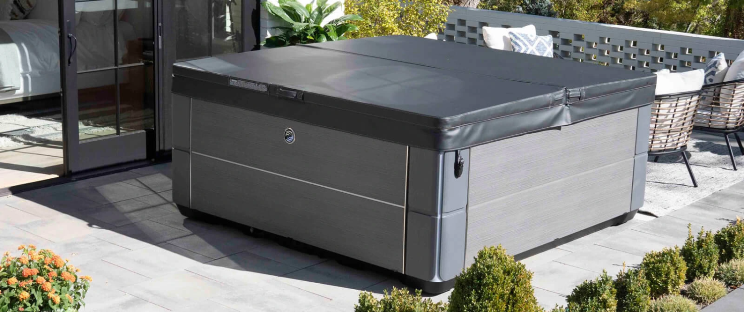 hot-spring-highlife-envoy-alpinewhite-charcoal-cover-in-sunshine